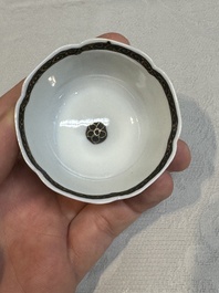 A set of four Chinese gilt-decorated grisaille 'landscape' cups and saucers, Yongzheng/Qianlong
