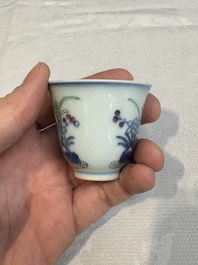 A pair of Chinese doucai 'narcissus' wine cups, Guangxu mark and of the period