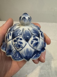 A pair of Chinese blue and white vases and covers with floral design, Kangxi