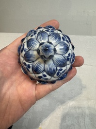 A pair of Chinese blue and white vases and covers with floral design, Kangxi