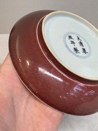 A Chinese copper-red glazed plate, Kangxi mark, 19/20th C.