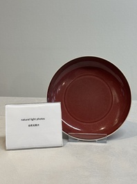 A Chinese copper-red glazed plate, Kangxi mark, 19/20th C.