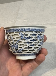 A pair of Chinese blue and white salts and a reticulated double-walled cup, Kangxi