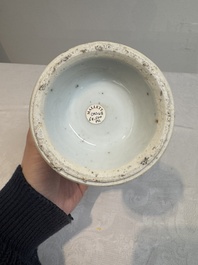 A pair of Chinese blue and white vases and covers with floral design, Kangxi