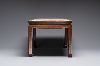 A Chinese famille rose turquoise-ground 'flower scrolls and bats' plaque, later mounted as table, Qianlong
