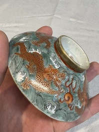 A Chinese fencai gilt-decorated 'dragons on waves' bowl and cover, Jiaqing mark, 19th C.