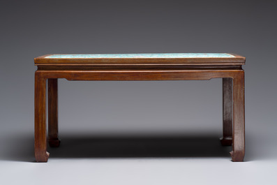 A Chinese famille rose turquoise-ground 'flower scrolls and bats' plaque, later mounted as table, Qianlong