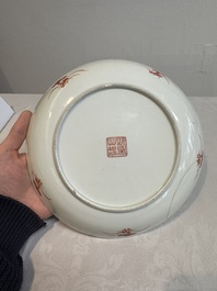 A Chinese famille rose 'bats and peaches' plate, Xie Zhu Zhu Ren 薢竹主人造 mark, 19th C.
