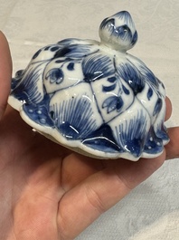 A pair of Chinese blue and white vases and covers with floral design, Kangxi