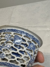 A pair of Chinese blue and white salts and a reticulated double-walled cup, Kangxi