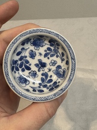 A pair of Chinese blue and white salts and a reticulated double-walled cup, Kangxi
