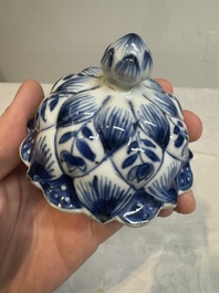 A pair of Chinese blue and white vases and covers with floral design, Kangxi