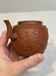 A Chinese Yixing stoneware 'phoenixes and peonies' teapot and cover, Kangxi