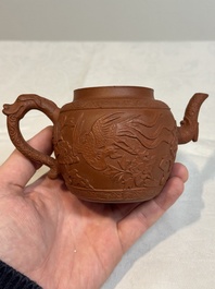 A Chinese Yixing stoneware 'phoenixes and peonies' teapot and cover, Kangxi