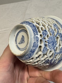 A pair of Chinese blue and white salts and a reticulated double-walled cup, Kangxi