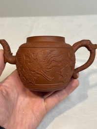 A Chinese Yixing stoneware 'phoenixes and peonies' teapot and cover, Kangxi