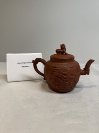 A Chinese Yixing stoneware 'phoenixes and peonies' teapot and cover, Kangxi