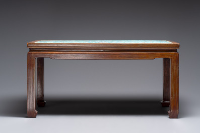 A Chinese famille rose turquoise-ground 'flower scrolls and bats' plaque, later mounted as table, Qianlong