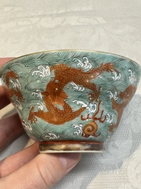 A Chinese fencai gilt-decorated 'dragons on waves' bowl and cover, Jiaqing mark, 19th C.