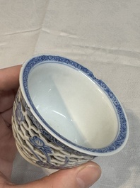 A pair of Chinese blue and white salts and a reticulated double-walled cup, Kangxi