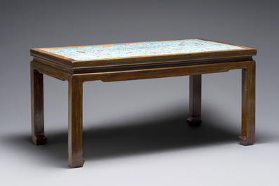 A Chinese famille rose turquoise-ground 'flower scrolls and bats' plaque, later mounted as table, Qianlong