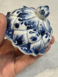 A pair of Chinese blue and white vases and covers with floral design, Kangxi