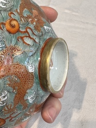 A Chinese fencai gilt-decorated 'dragons on waves' bowl and cover, Jiaqing mark, 19th C.