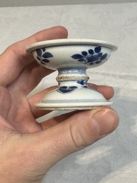 A pair of Chinese blue and white salts and a reticulated double-walled cup, Kangxi
