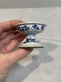 A pair of Chinese blue and white salts and a reticulated double-walled cup, Kangxi