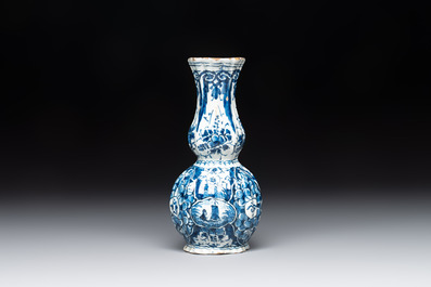 A ribbed blue and white Dutch Delft double gourd vase, 18th C.