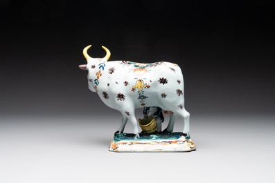 A pair of polychrome Dutch Delft milking groups, 18th C.