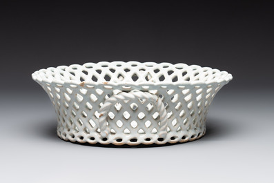 A round white-glazed reticulated pottery basket, Brussels or France, 18th C.