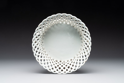 A round white-glazed reticulated pottery basket, Brussels or France, 18th C.