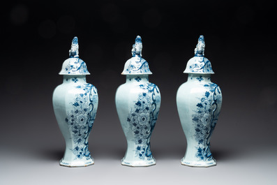 A large blue and white Dutch Delft garniture of five vases and covers, 2nd half 18th C.