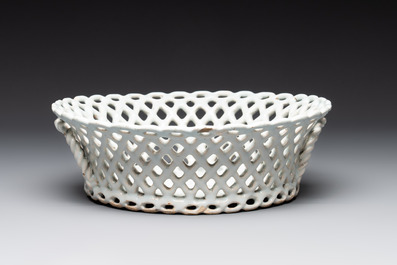 A round white-glazed reticulated pottery basket, Brussels or France, 18th C.