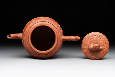 A Chinese Yixing stoneware 'phoenixes and peonies' teapot and cover, Kangxi