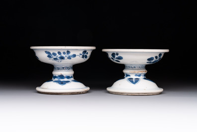 A pair of Chinese blue and white salts and a reticulated double-walled cup, Kangxi