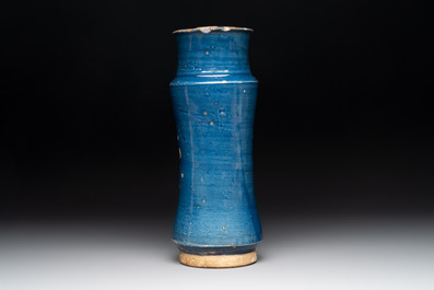 A blue-glazed albarello and two white-glazed albarelli, Spain, 17th C.