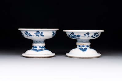 A pair of Chinese blue and white salts and a reticulated double-walled cup, Kangxi