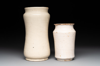 A blue-glazed albarello and two white-glazed albarelli, Spain, 17th C.