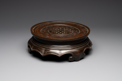 A massive Vietnamese copper- and silver-inlaid 'Buddhist lion' censer and cover on stand, 19th C.
