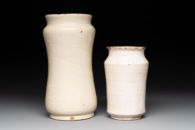 A blue-glazed albarello and two white-glazed albarelli, Spain, 17th C.