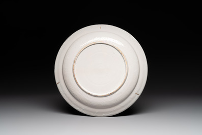 A polychrome Dutch Delft mixed technique dish with a fine landscape, 18th C.
