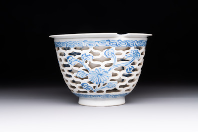 A pair of Chinese blue and white salts and a reticulated double-walled cup, Kangxi