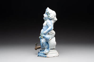A polychrome Dutch Delft table fountain in the shape of Bacchus on a barrel, early 18th C.