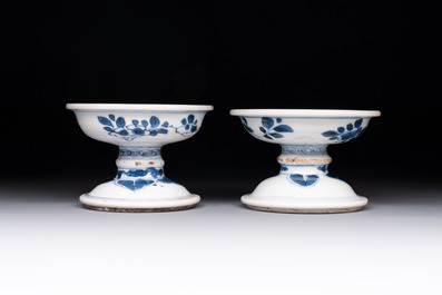 A pair of Chinese blue and white salts and a reticulated double-walled cup, Kangxi