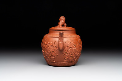 A Chinese Yixing stoneware 'phoenixes and peonies' teapot and cover, Kangxi