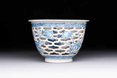 A pair of Chinese blue and white salts and a reticulated double-walled cup, Kangxi