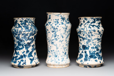 Three blue and white splash-glazed albarelli, Spain, 17th C.