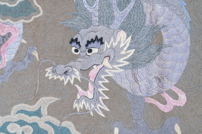 A Japanese embroidered wool and silk wall tapestry with a dragon and qilin, Meiji, 19th C.